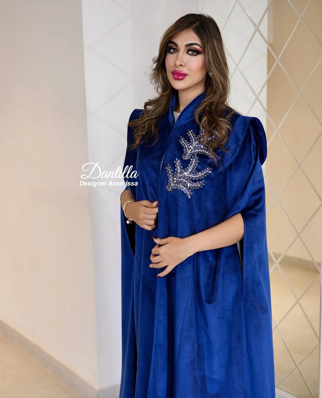 Shine with sophistication in this distinctive navy blue cape