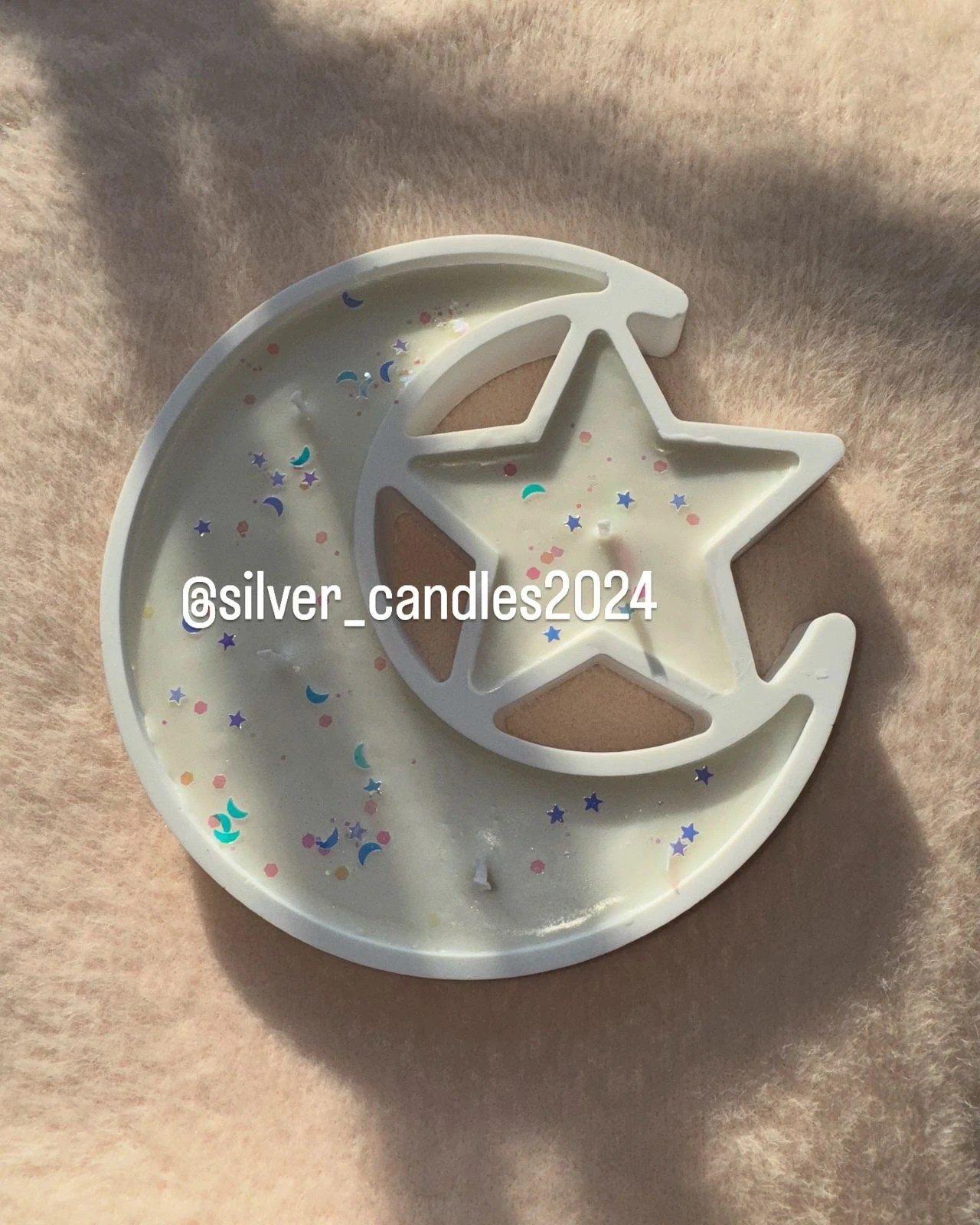 Crescent and star-shaped candle